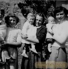 Norma Strachan is the one on the right ,  -  Patricia Ogston is the baby being held by the girl in the middle.
