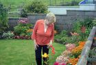 Claire Pudsey with final touches to her garden